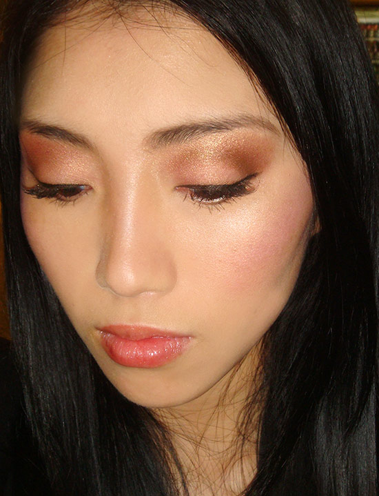 Metallic gold eye makeup with contoured cheeks