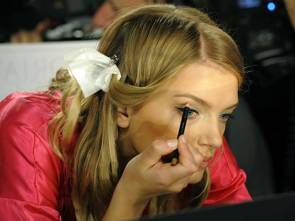 Lily Donaldson doing makeup at Victoria's Secret 2011 Fashion Show Backstage