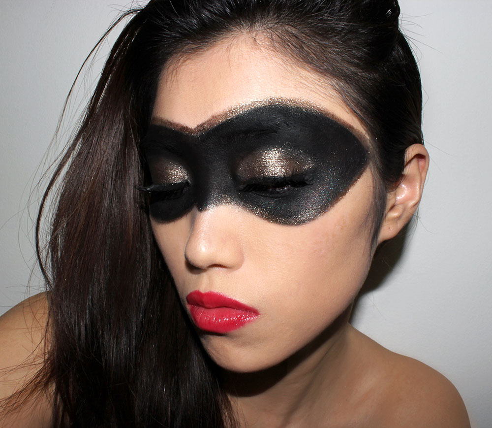 Superhero makeup with black eye mask and red lips