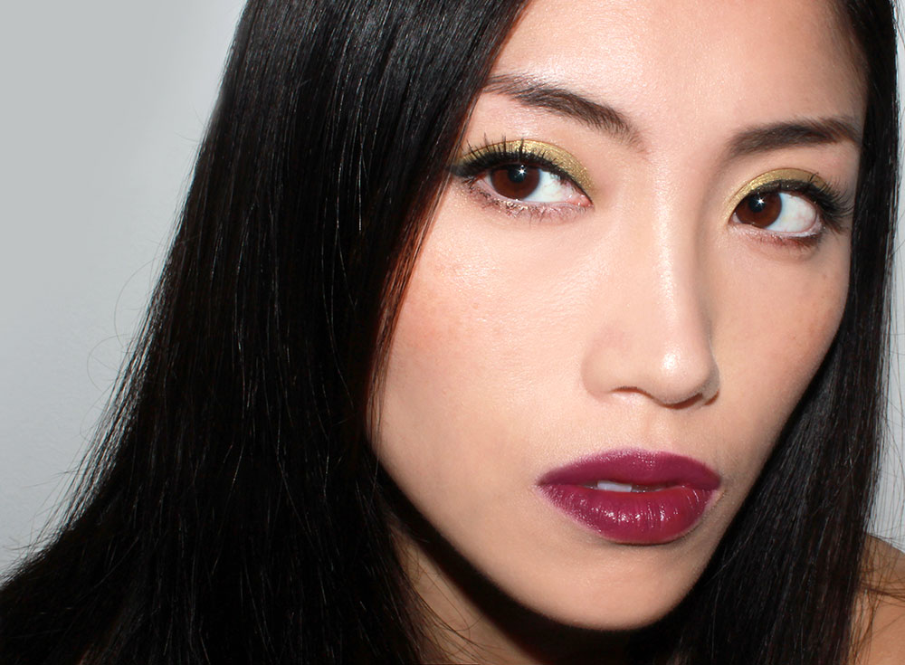 Olive eyeshadow and burgundy lipstick fall makeup look